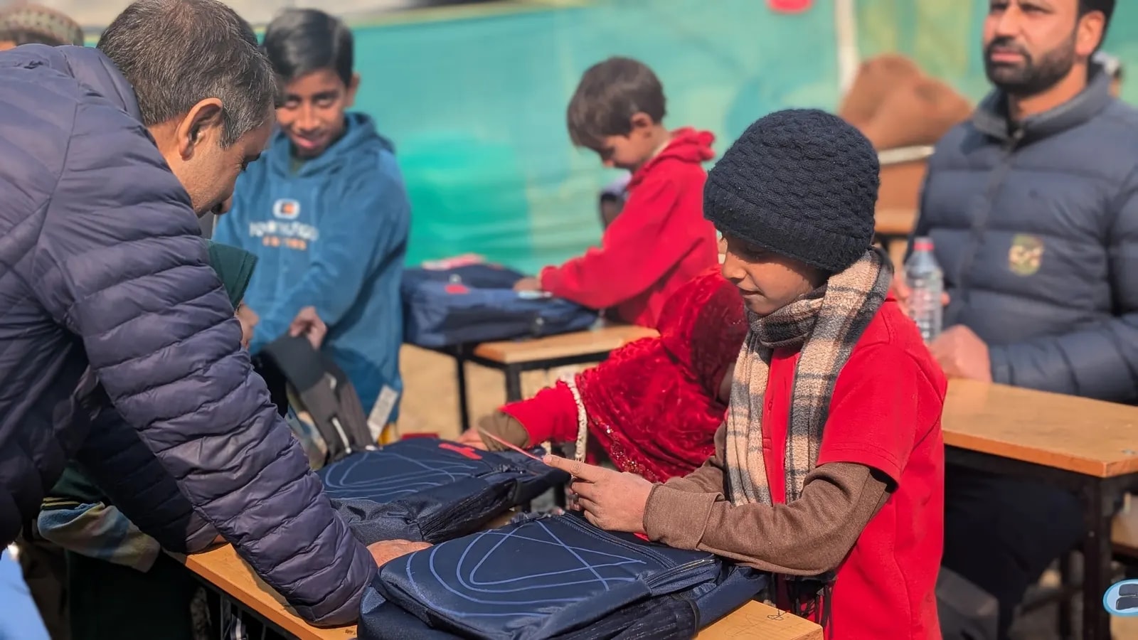 A student receiving a new school bag